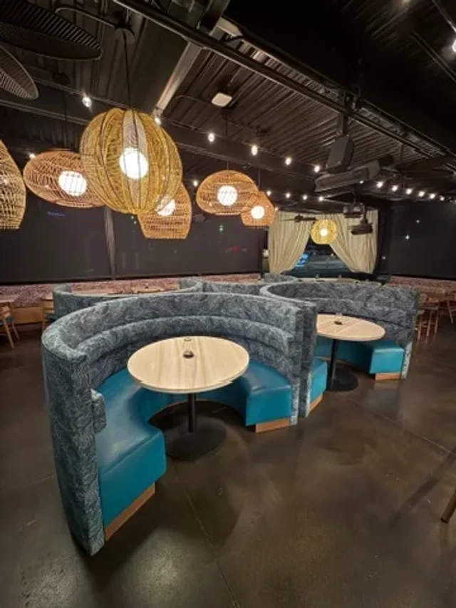 Circular upholstered booths with round dining tables