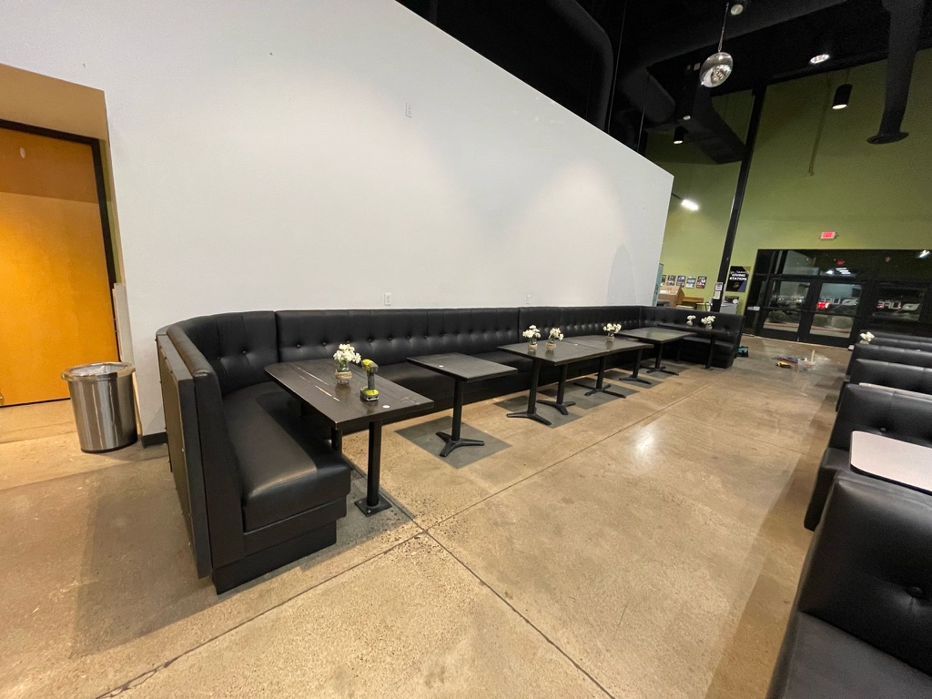 Black booth seating in an Arizona church gathering area