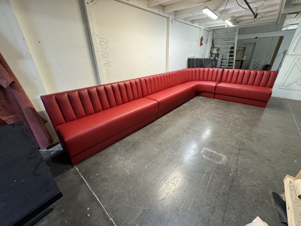 red channel corner banquette workshop — Workshop seating photograph