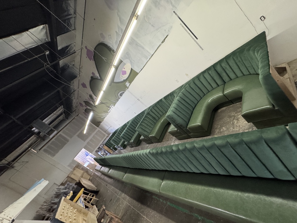 Green channel-back booths for an Oklahoma project