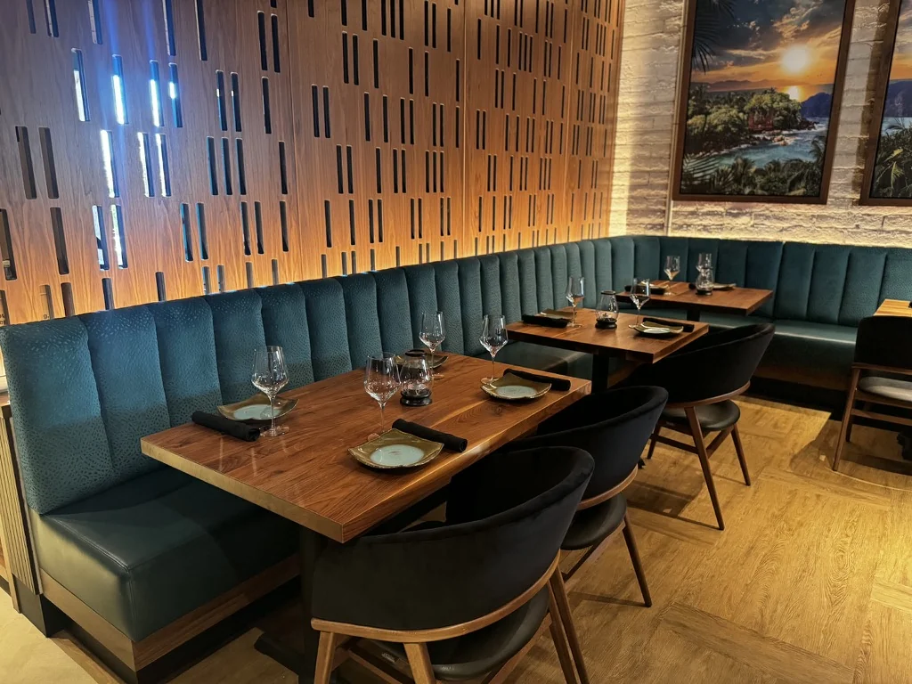 Teal channel banquette seating beside dining tables at Starfish in Scottsdale