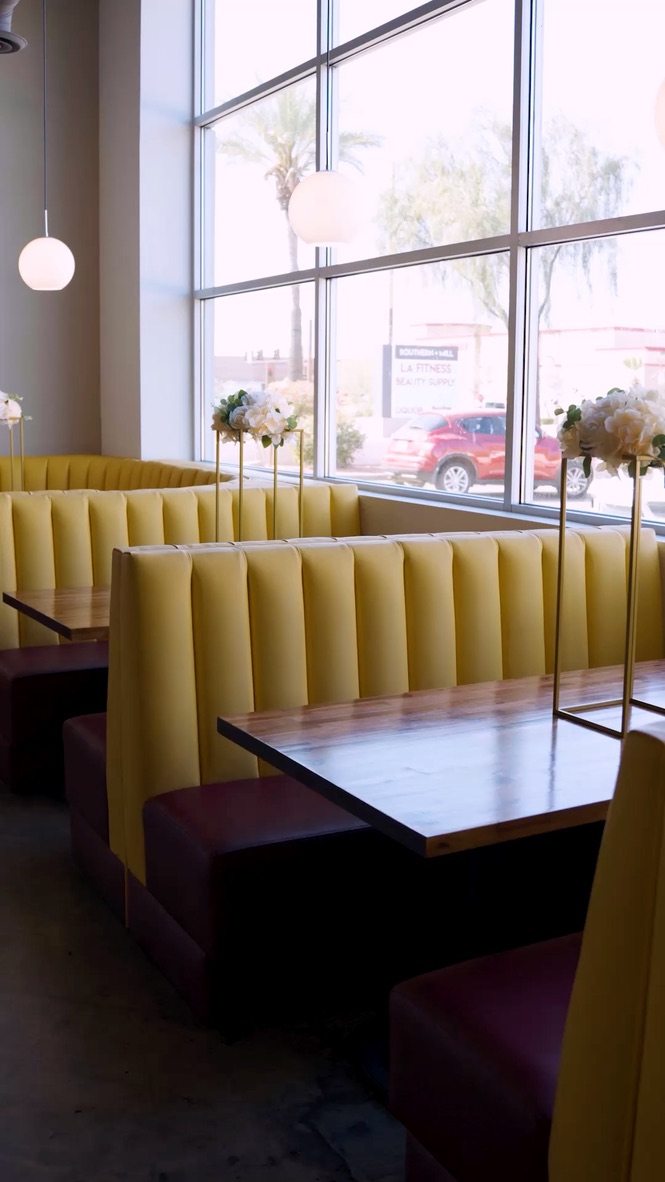 Yellow channel-back booths at Tempe Eats