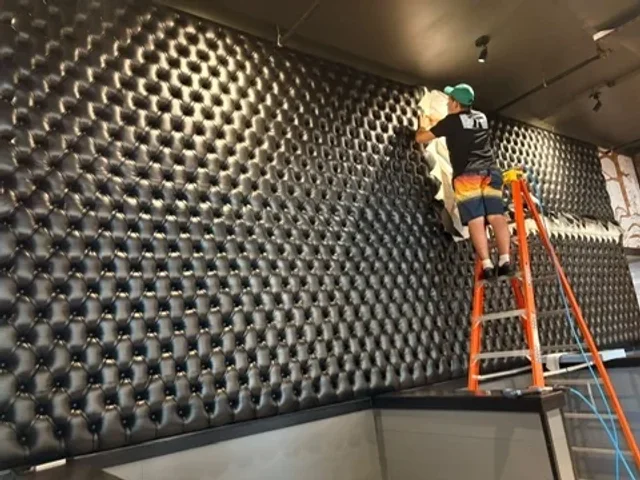 Installation of a large diamond-tufted wall panel