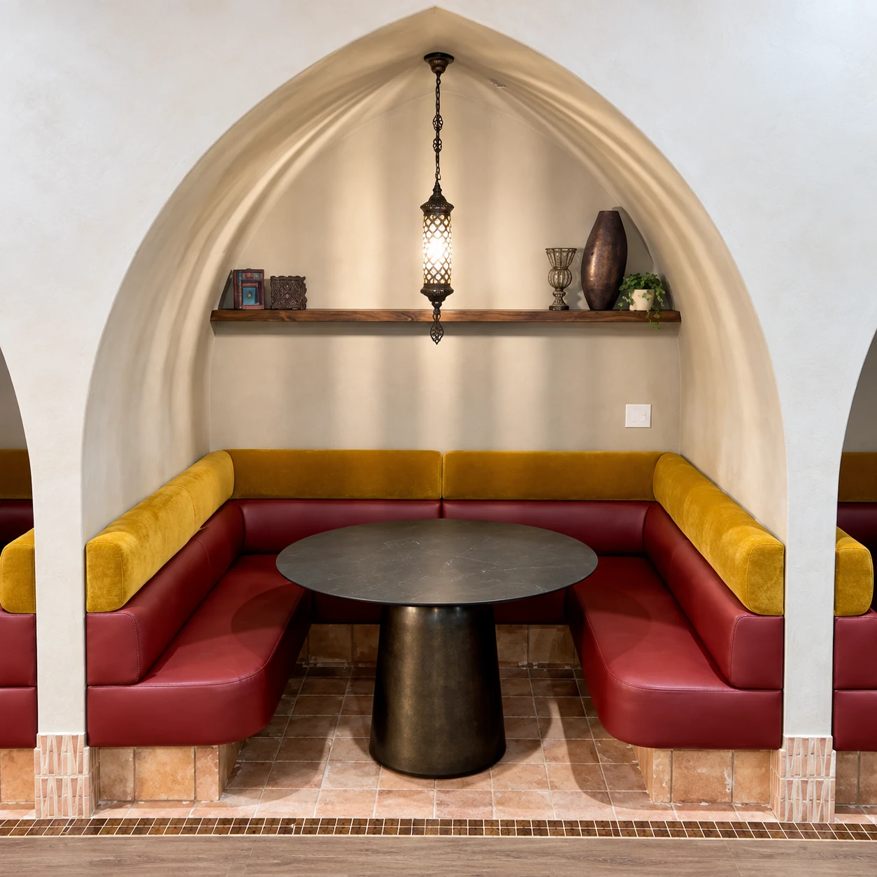US Booths Signature U-shaped seating with smooth mustard and burgundy upholstery beneath a restaurant arch